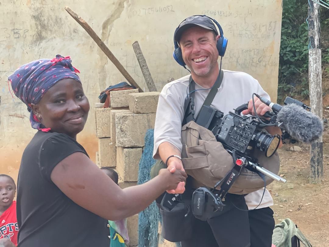 A Dixcove community member saying goodbye to the crew after filming