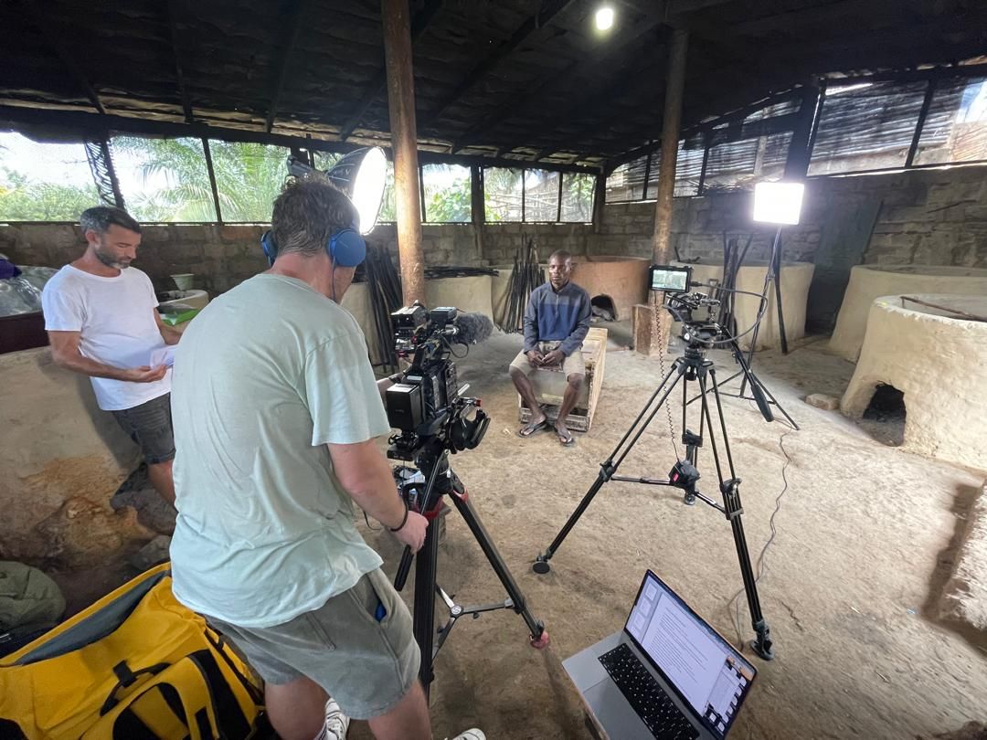 Crew setting up an interview inside a fish-smoking shed in Dixcove