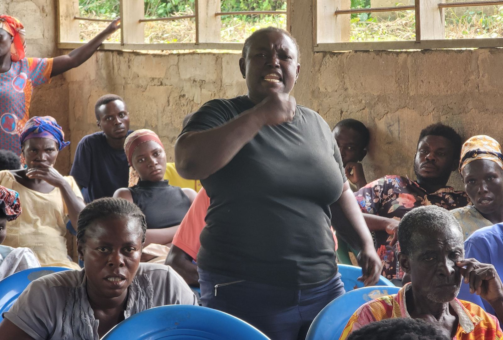 A community member sharing a concern during an Ewoyaa lithium project dialogue session