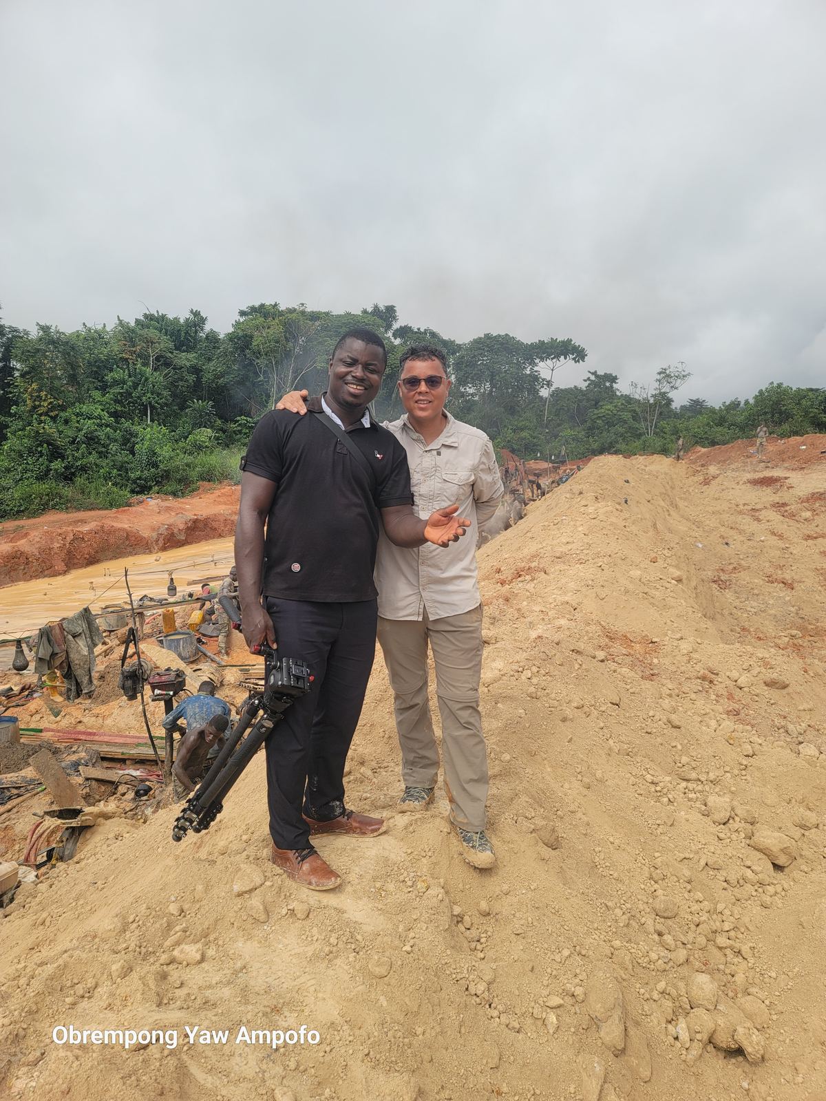 GRRMC team member and crew member together at the edge of a mining site